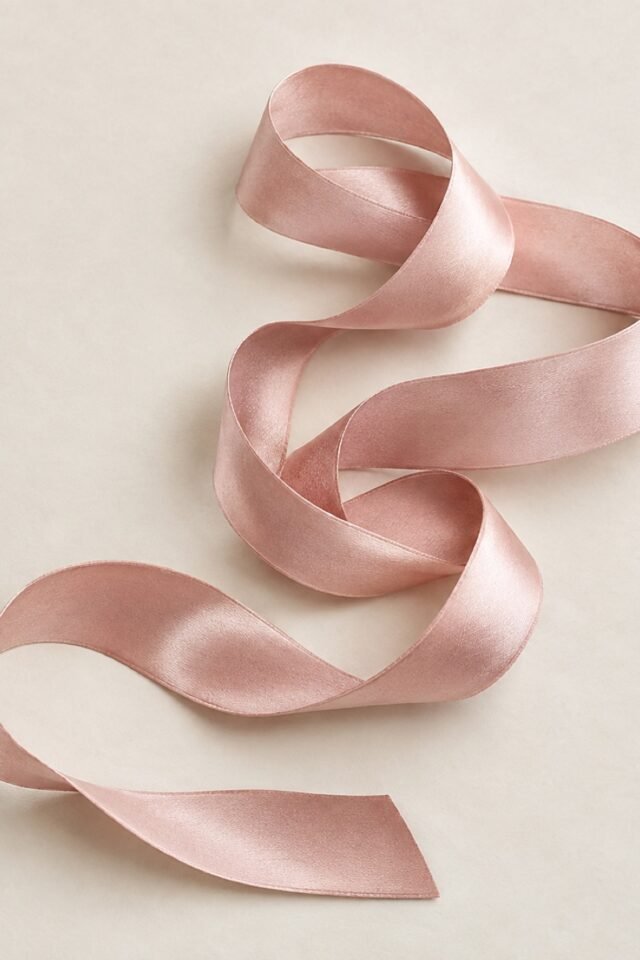 Minette Tie-Back Ribbon Choker in powder blush, laid flat.